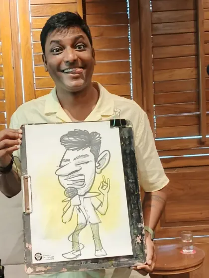 Here I am with one of my finished pieces. I love making people laugh with my art, and live events are the perfect place for that.