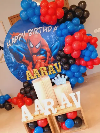 This view of the Spiderman setup highlights the marquee letters placed in wooden crates, adding a rustic and modern touch to the superhero theme.