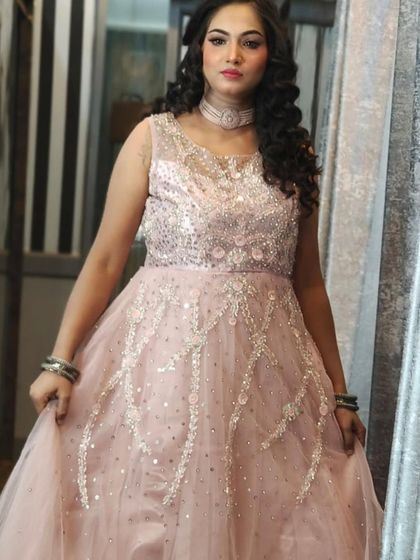 This client is rocking a beautiful pink gown with silver embellishments. It’s a versatile piece that’s perfect for attending a wedding or for your own party.