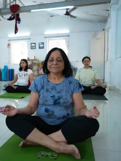 A dedicated yogi finds her moment of peace in our class. Our community is built on the strength and commitment of students like her.