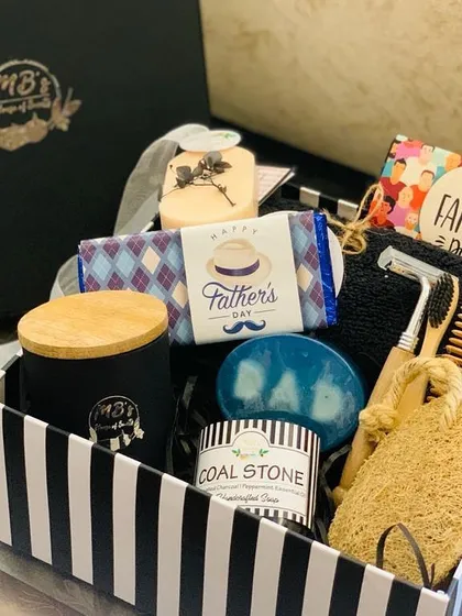 This is my 'Box of Scents' curated especially for Father's Day. It’s a complete grooming and relaxation kit, including a soy candle, handcrafted soaps, and sustainable bamboo essentials like a neem comb and shaving razor.