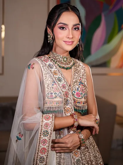 A close-up portrait that highlights the flawless, glowing skin and softly defined eyes. This is the essence of my luxury bridal makeup: enhancing, not hiding.