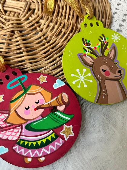 An angel and a reindeer with Christmas lights, more of our festive wooden ornaments.