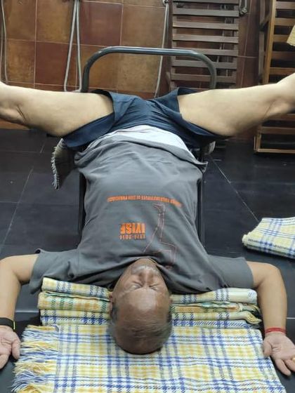 A headstand variation on a chair.