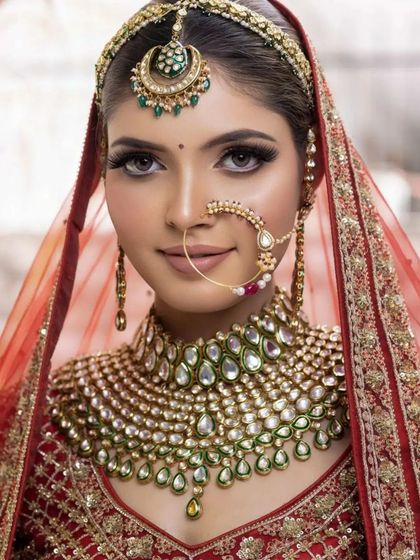 A perfect bridal close-up. The skin is glowing, the eyes are defined, and the lip color is a soft nude that balances the look.