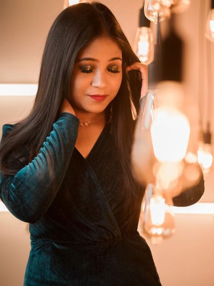 This photo captures the mood of a cocktail look perfectly. The dark, blended eyeshadow and the subtle red lip create a look of effortless glamour.