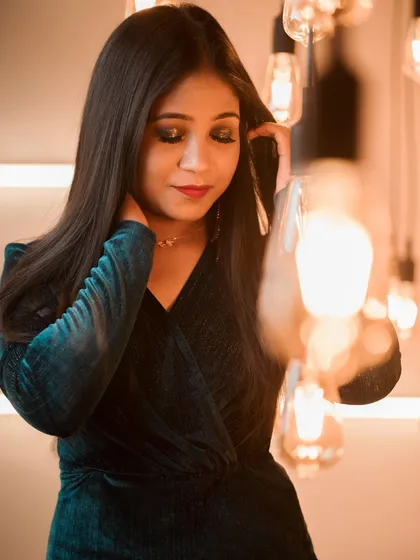 This photo captures the mood of a cocktail look perfectly. The dark, blended eyeshadow and the subtle red lip create a look of effortless glamour.
