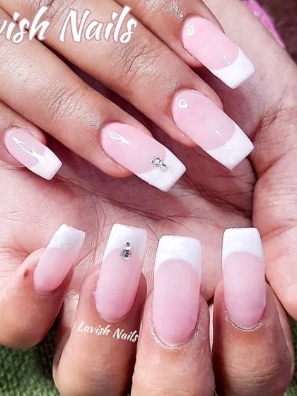A classic French manicure on square nails with a subtle rhinestone accent.