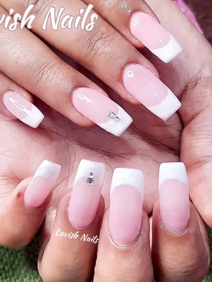 A classic French manicure on square nails with a subtle rhinestone accent.