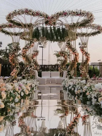 This is the canvas where your forever begins. I designed this grand pastel mandap with cascading florals and a mirrored aisle to feel like stepping into a real-life fairytale, perfect for an unforgettable outdoor wedding ceremony.