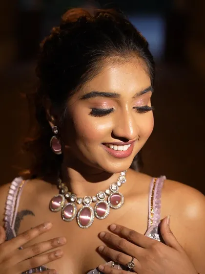 A lovely, candid moment. The makeup looks soft and natural, perfect for capturing genuine emotions.