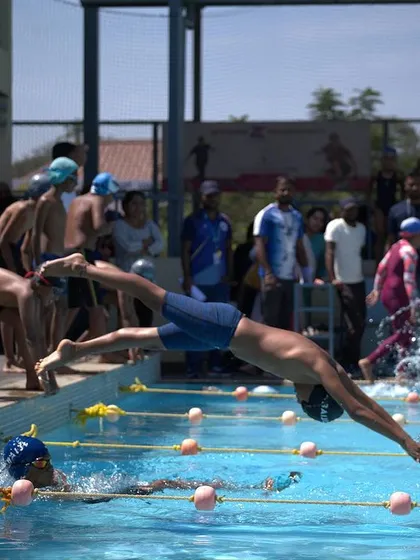 The moment of launch. Our swimmers practice race starts relentlessly, learning to explode off the blocks with perfect form to gain an immediate advantage in the water.