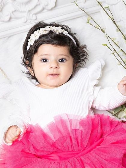 Shooting with a 3-month-old is not an easy task, but the results are always worth it. This little one looks so sweet in her pink tutu.