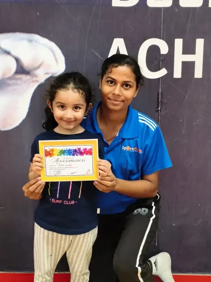 This little gymnast is all smiles as she receives her certificate. We make sure every child feels seen and celebrated for their individual achievements.