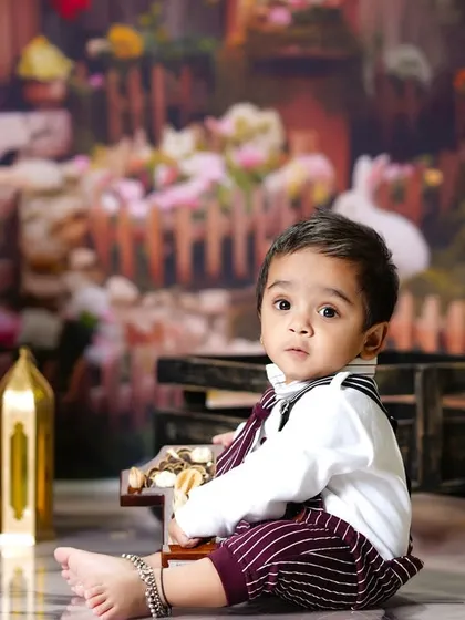 A candid side-profile of the little boy in our Easter village, creating a sweet and thoughtful portrait.