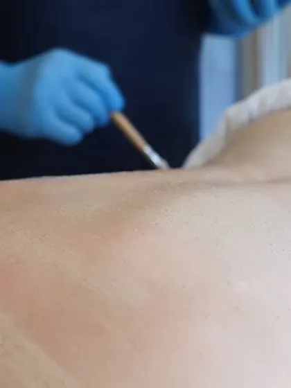 Reveal your natural glow with our skin rejuvenation body scrub. Here, we are applying a natural exfoliating paste to gently polish the skin, removing dead cells and leaving it feeling soft, smooth, and radiant.