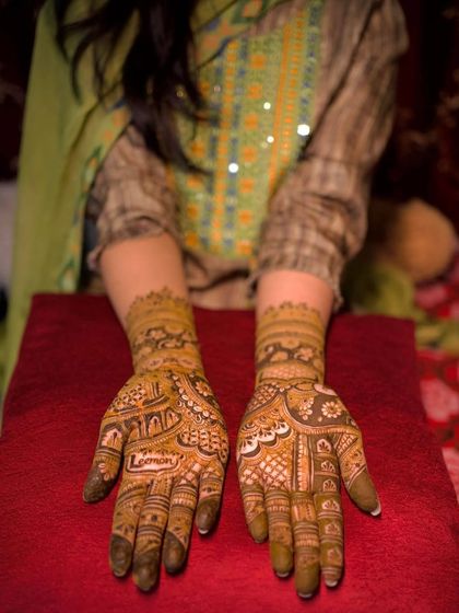 A detailed mehndi design with a mix of traditional patterns. This is a great option for family members who want their henna to be rich and full.