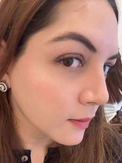 A side profile showcasing the delicate curl and length of a natural lash set. It provides just enough lift to open up the eye.