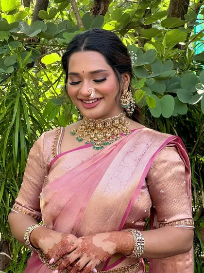 A close-up of Isha's engagement makeup. We paired a soft winged liner with a warm nude lip to complement her gorgeous gold choker and traditional nose ring.