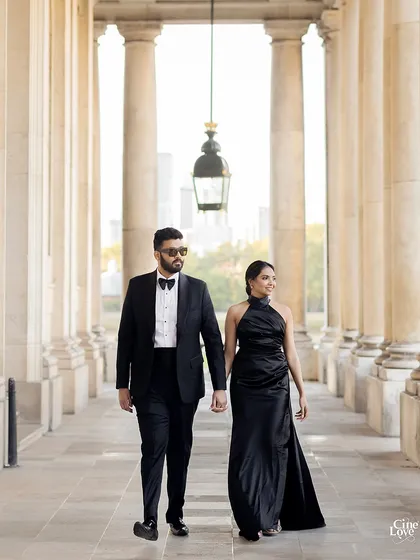 A pre-wedding shoot in London, styled with bold, classic elegance. The couple's all black attire creates a powerful statement of modern romance against the city's timeless architecture.