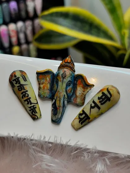 Celebrating Ganesh Chaturthi with divine nail art. This intricate, hand-painted 3D Ganpati design is a sample of the detailed festive art we teach.