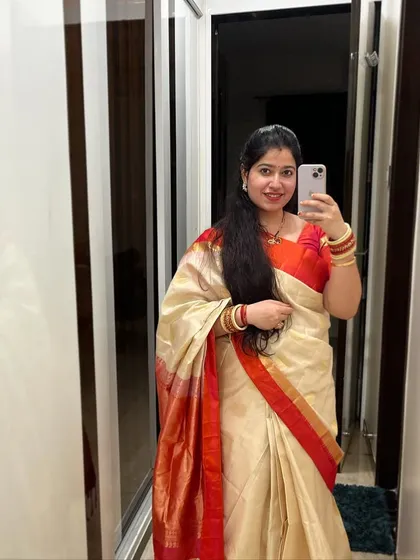 A mirror selfie capturing the beautiful details of a silk saree. I love how traditional attire makes me feel connected to my culture, which is a big part of my dance inspiration.