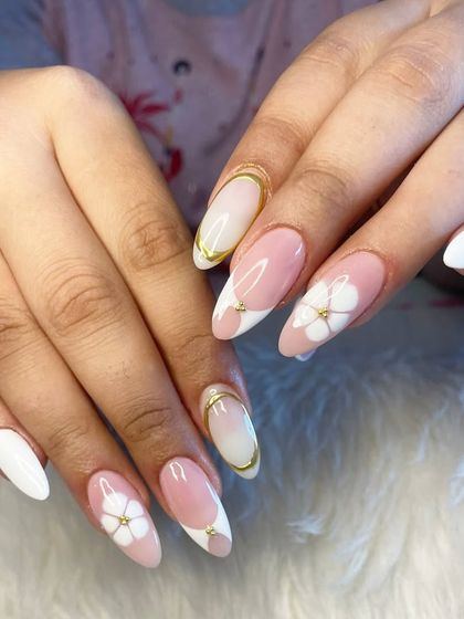 Another view of the sophisticated white and floral manicure.