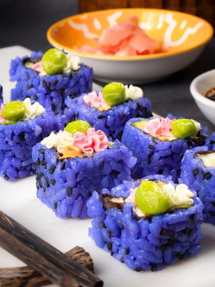 A platter of my Blue Rice sushi ready to be served, looking like little jewels.