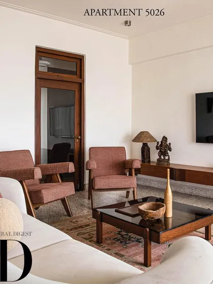 This living room from Apartment 5026, featured in Architectural Digest, honors the home's Art Deco setting. We incorporated timeless furniture pieces and a rich color palette to revive the space, making it authentic, chic, and globally influenced.