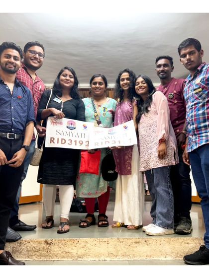 Holding up the banner for our Rotaract Inter-District Youth Exchange (RIDE) program.