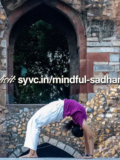 Urdhva Dhanurasana (Wheel Pose) is a powerful heart-opener. This image, set against ancient architecture, symbolizes the deep, foundational knowledge shared in our Mindful Sadhana online course for dedicated practitioners.