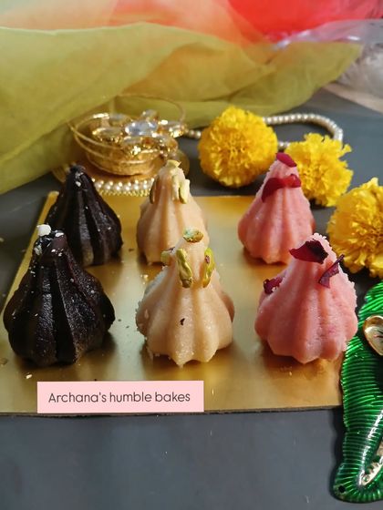 For the Ganpati festival, I prepare these delicious homemade modaks. This platter shows three different flavors: Chocolate Truffle, Rose Gulkand, and Mava Mikhai, all ready to be offered to Bappa.