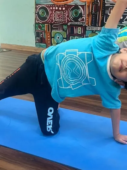Look at that focus! Our kids' yoga sessions are designed to be fun and engaging, helping children build strength, balance, and confidence from a young age.