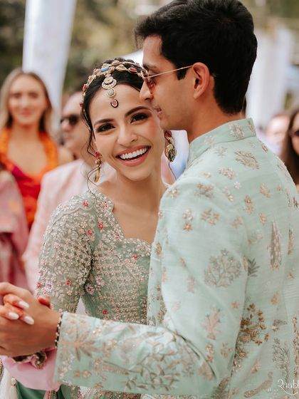 A happy, candid shot of the couple during their pre-wedding festivities. Our goal is to create a relaxed atmosphere where you can be yourselves.