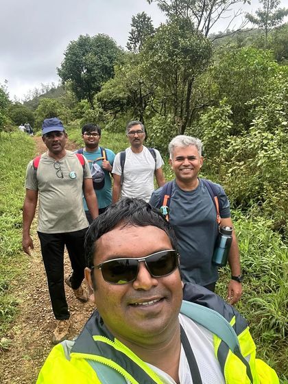 A selfie with the group during the Thadiyandamol trek, all smiles on the trail.