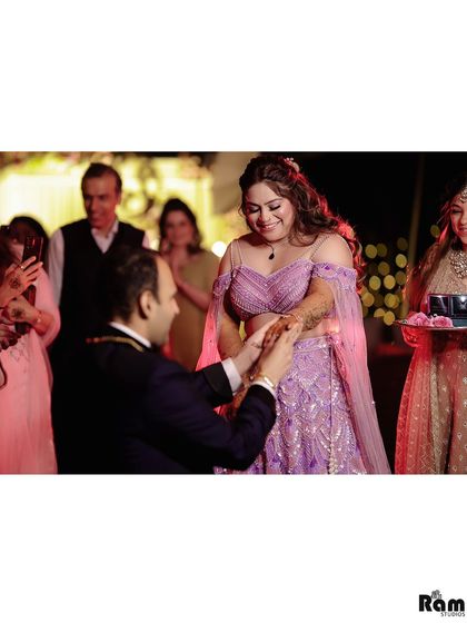 The pivotal moment of the ring exchange. Capturing the groom on one knee as he places the ring on her finger is a memory that every couple will cherish forever.