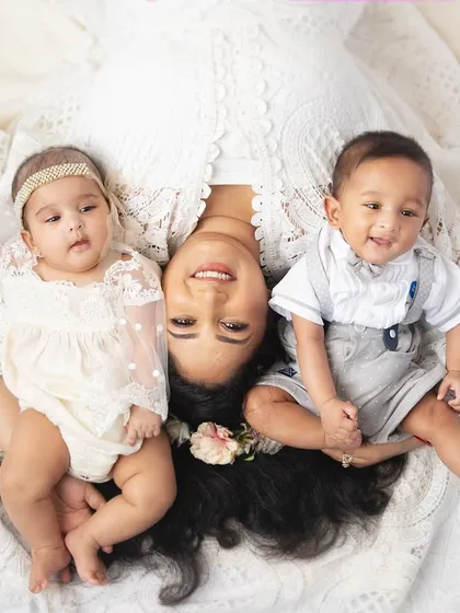 A beautiful overhead portrait of a mother with her boy and girl twins. This pose creates a lovely, symmetrical composition that is full of love.