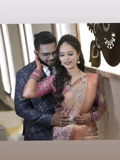 A romantic moment between the bride and groom at their reception. I love creating looks that make couples feel connected and confident on their special day.