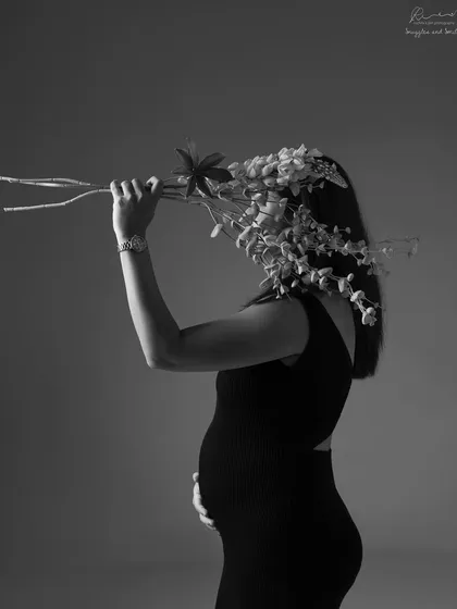 An artistic and creative pose using flowers. This black and white shot is for the mom who wants something a little different and more abstract.