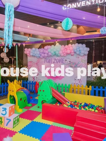 A view focusing on the ball pit and slide within our rainbow play zone, a favorite feature for young children.