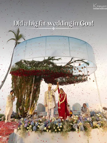 A spectacular wedding ceremony in Goa. The unique circular mandap, adorned with red flowers and surrounded by water, created a stunning focal point for this beachside celebration.
