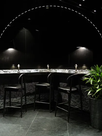 This is your corner of the Lair. Our design is intentional, creating intimate spaces with low lighting and modern textures for private conversations and memorable nights.