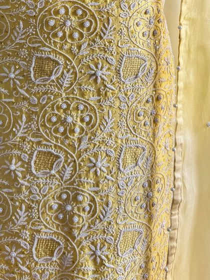 A detail shot of the kurta's front panel, showing the beautiful density of the Chikankari work.