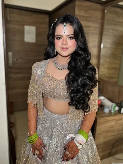 The complete look, with beautiful soft curls and a sparkling lehenga.