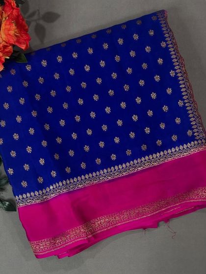 A royal blue Bentex Banaras saree with a contrasting rani pink border and delicate butis.