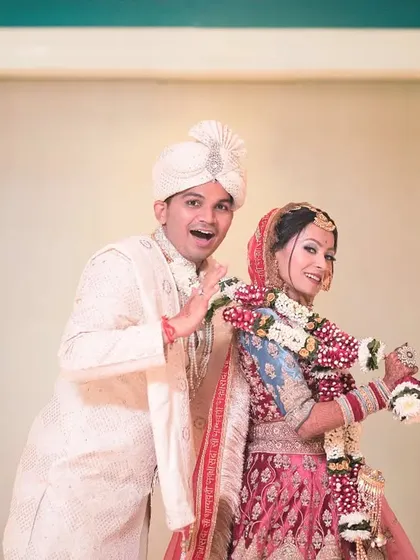 A playful and candid portrait of the couple after their ceremony. Moments like these add personality and fun to your wedding album.