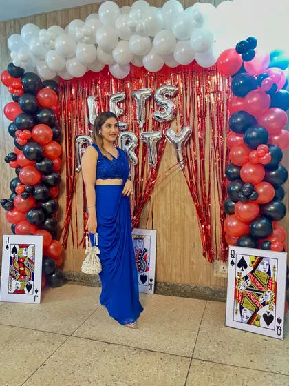 The beauty of a drape saree is its effortless elegance. This royal blue piece is perfect for a party look, styled with a pearl potli bag to add a touch of traditional charm.