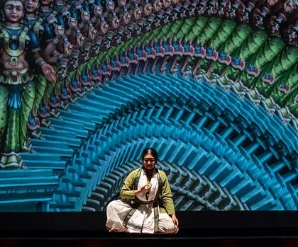 A meditative moment from 'Antariksha Sanchar', where my character contemplates a vast, fractal universe projected on screen. This shows how we use VFX to expand the emotional landscape of a performance.