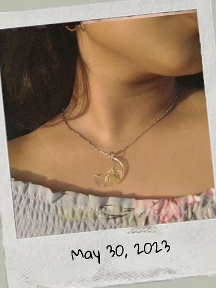 Here I am wearing the crescent moon pendant to show how it looks. It's lightweight and catches the light beautifully.