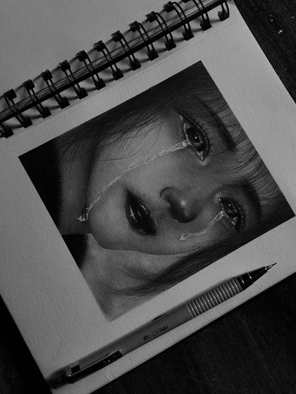 Another angle of the emotional crying portrait, showing the full composition in my sketchbook. This piece is a testament to how art can express feelings that words cannot.